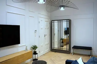 a living room with a flat screen tv on a wall at Exclusive, unique apartment, 2 bathrooms, 105sqm in Kraków