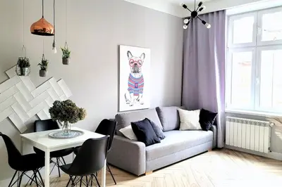 a living room with a couch and a table at Wild & Huge comfy apartment 5 min to Main Square in Kraków