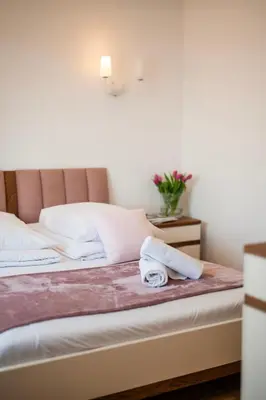 a hotel room with a bed with a towel on it at Florencja Moxy TE&AM Stare Miasto Dworzec 3 min Parking GRATIS in Kraków