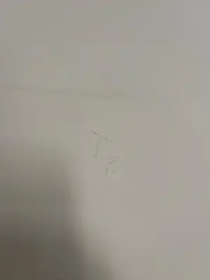 a piece of paper on a wire on a wall at Apartment Batorego st. in Kraków