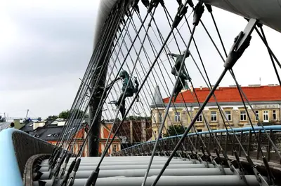 a bridge in a city with buildings in the background at Premium Loft Apartments-City Center Parking by Urban Escape in Kraków