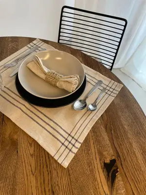 a plate on a table with a napkin and a spoon at Premium Loft Apartments-City Center Parking by Urban Escape in Kraków