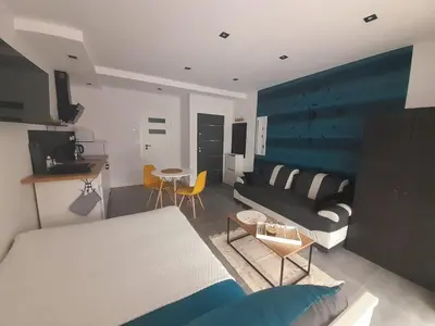 a living room with a couch and a table at Viva Apartments in Oświęcim
