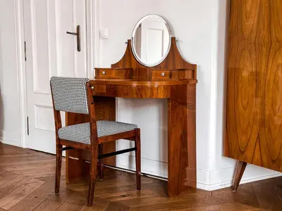 a wooden desk with a mirror and a chair at Once Upon a Time in Cracow - Old Town Apartment in Kraków