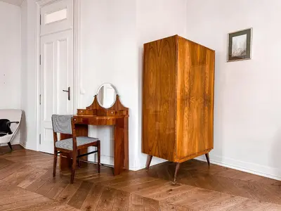 a room with a wooden dresser and a mirror at Once Upon a Time in Cracow - Old Town Apartment in Kraków