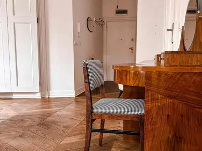 a room with a wooden table and a chair at Once Upon a Time in Cracow - Old Town Apartment in Kraków