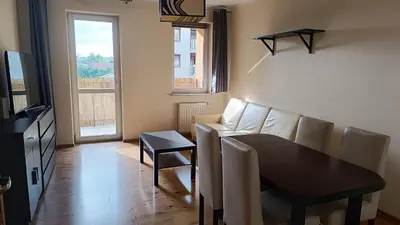 a living room with a couch and a table at Radzikowskiego 100B in Kraków