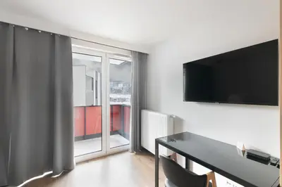 a bathroom with a shower with a glass door at Apartamenty Platinex 1 in Kraków