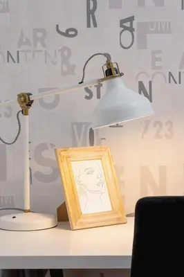 a lamp sitting on a desk next to a picture at Spacious & Cozy Apartment Grzegórzecka by Noclegi Renters in Kraków