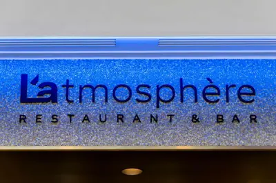 a sign for a hairciplinary restaurant and bar at Hilton Garden Inn Krakow Airport in Kraków