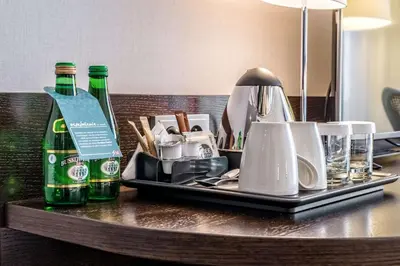 a tray with two bottles of beer on a table at Hilton Garden Inn Krakow Airport in Kraków