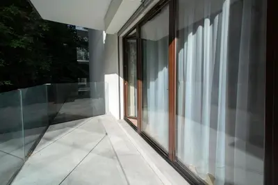an external view of a building with glass windows at Apartament Kościuszki 47m44 in Kraków