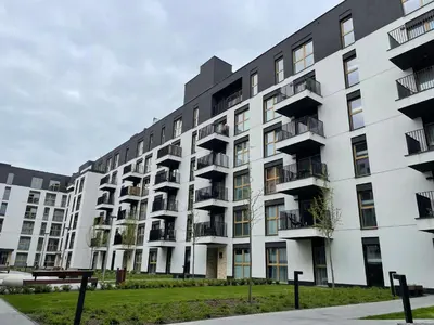 an apartment building with balconies on the side of it at Imperial Citi Apartament in Kraków