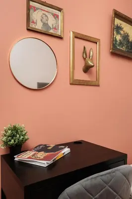a table with a mirror on a pink wall at Stylowy apartament - 6 sypialni - Kraków, Stare Miasto - by Upstairs in Kraków