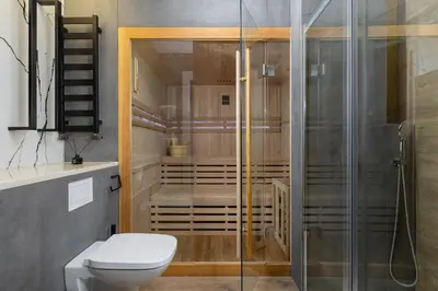 a bathroom with a shower and a toilet at Apartment with Private Sauna - Dietla 21 street in Kraków