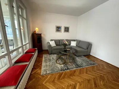 a living room with a couch and a table at Cracow Heart Apartment in Kraków