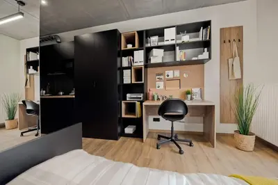 an office with a desk and a chair in a room at SHED Living Kraków in Kraków