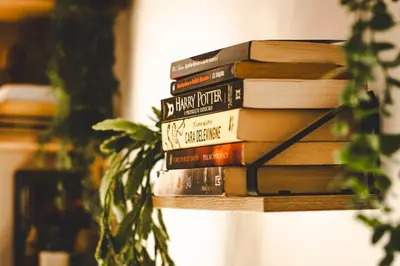 a stack of books stacked on top of each other at Na Kamieńcu domki in Rzyki