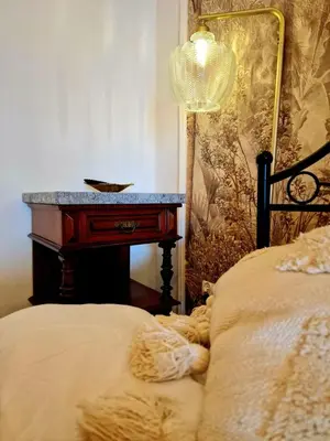 a bedroom with a bed with a desk next to it at Apartament Kety Rynek Mickiewicza in Kęty