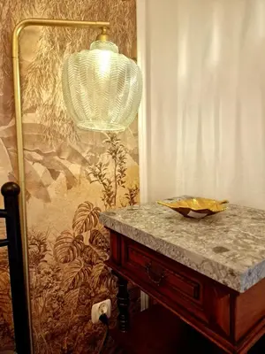 a table with a lamp on top of it at Apartament Kety Rynek Mickiewicza in Kęty