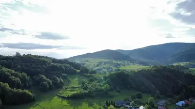 an aerial view of a valley with mountains at Mogielicki Zakątek in Jurków