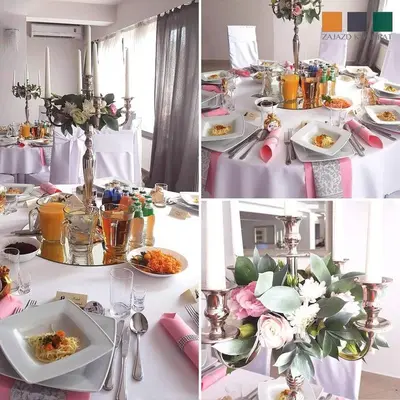 a white table with plates of food and flowers on it at Zajazd Kwadrat in Dąbrowa Górnicza