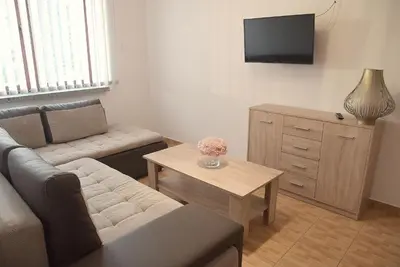a living room with a couch and a table at Zajazd Kwadrat in Dąbrowa Górnicza