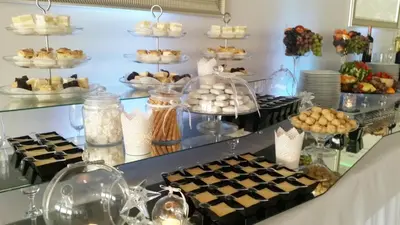 a buffet with cakes and other desserts on display at Zajazd Kwadrat in Dąbrowa Górnicza