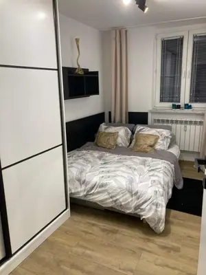 a bedroom with a bed in a room at Best of Azory apartment in Kraków