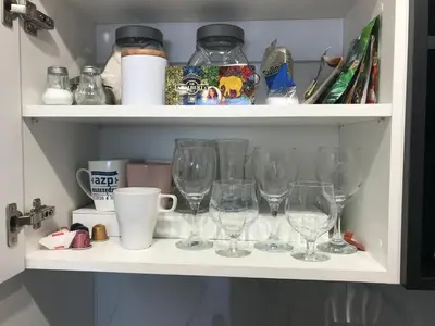 a row of wine glasses sitting on a shelf at Best of Azory apartment in Kraków