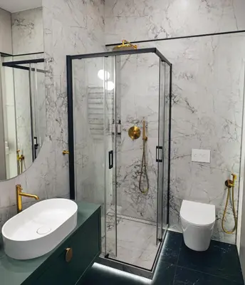 a bathroom with a shower with a sink and a toilet at Sage & Timber Apartment Kazimierz in Kraków