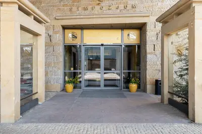 an entrance to a store with a glass door at Park Zakrzówek Cosy Studio by BookingHost in Kraków