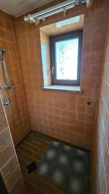 a bathroom with a shower and a window at Zajazd-restauracja Zyga in Iwkowa