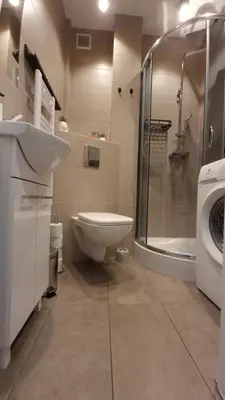 a bathroom with a toilet sink and a shower at Underground Cave Apartment in Wieliczka