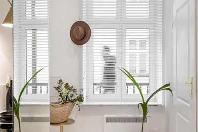 a room with a window with a person walking through it at Pędzichów Old Town Apartments in Kraków