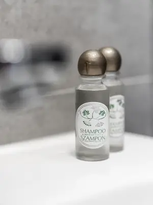 a bottle of shanghai vinegar with a wooden lid at Hotel Miodowa in Kraków