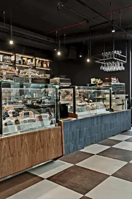 a display case in a bakery with many different foods at A charming loft in the heart of KRAKÓW with free parking in Kraków