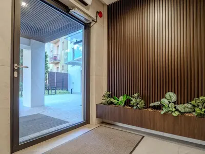 an entrance to a building with a door with plants at A charming loft in the heart of KRAKÓW with free parking in Kraków