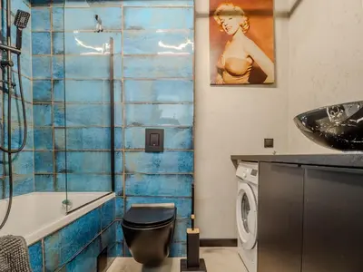 a bathroom with a toilet and a sink at A charming loft in the heart of KRAKÓW with free parking in Kraków