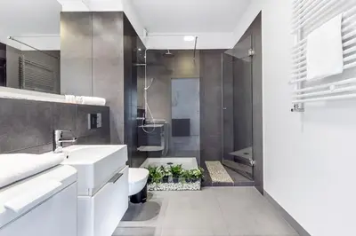 a bathroom with a sink and a toilet and a shower at Old Town Apartment Browar Lubicz Krakow in Kraków