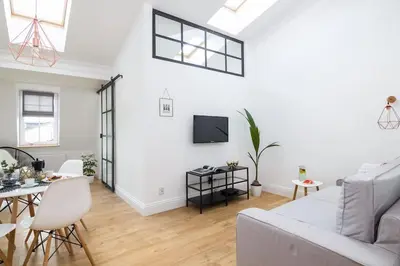 a living room with a couch and a table at Radziwiłłowska Old Town Apartments in Kraków