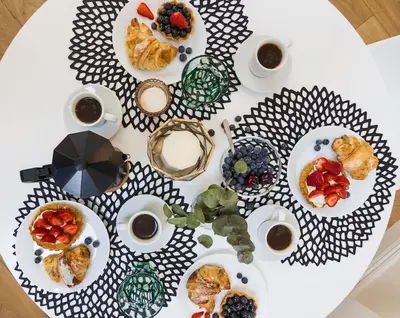 a table with plates of food on top of it at Radziwiłłowska Old Town Apartments in Kraków