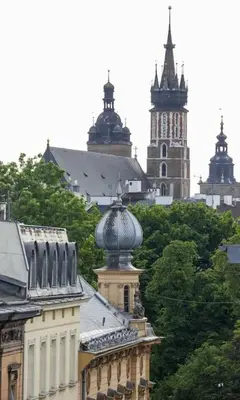 a view of a city with two towers and buildings at Radziwiłłowska Old Town Apartments in Kraków