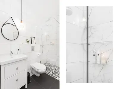a white bathroom with a toilet and a shower at Radziwiłłowska Old Town Apartments in Kraków