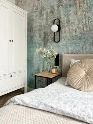 a bedroom with a bed and a table with flowers at LION apartments - PLATINIUM in Kraków