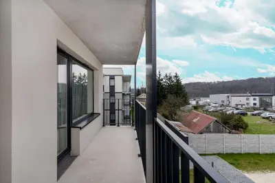 a balcony with a view of a parking lot at Prokocim Kosocicka Apartment by BookingHost in Kraków