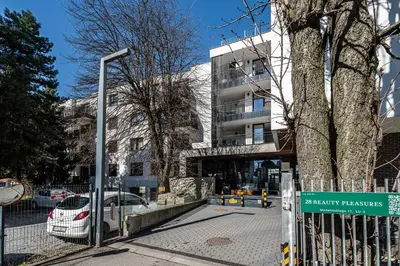a street sign in front of a building at RentPlanet - Apartament Dębniki in Kraków