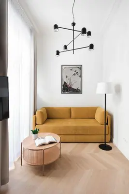 a living room with a couch and a table at Apartament Kazimierz Mostowa in Kraków