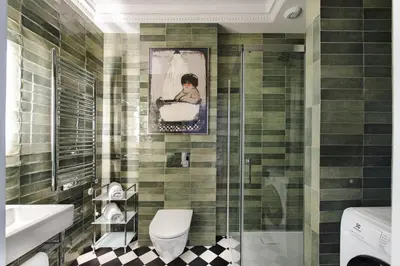 a bathroom with a picture of a child in a tub at Apartament Kazimierz Mostowa in Kraków