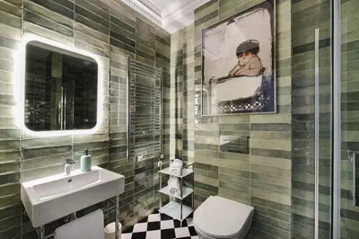 a bathroom with a sink and a toilet at Apartament Kazimierz Mostowa in Kraków
